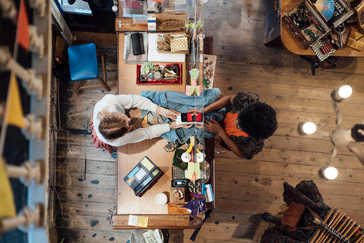 A young man enjoying a day out shopping in a vintage clothing store in Durham